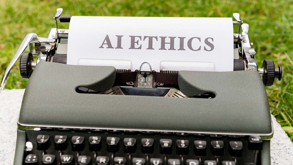 Eine Schreibmaschine mit einem eingespannten Blatt auf dem Al Ethics steht
