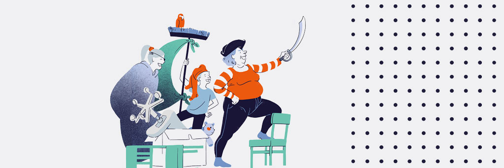 Zwei Kinder spielen gemeinsam mit ihrer Großmutter Piraten, sie hält einen Säbel in der Hand nach vorne